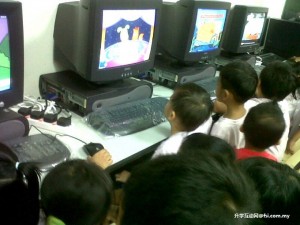 Children at the centre try out the newly donated computers.