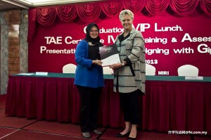 Joanne Stringer presenting certificate to Siti Kasmah Mohammad Kassim, one of the eight teaching staff.